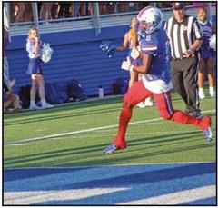 Runningback Eli Beal finds an opening around the corner for the touchdown