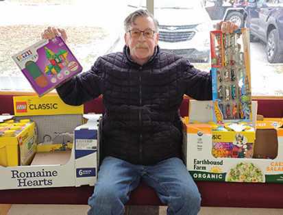 Brian Simpson with gift donations.