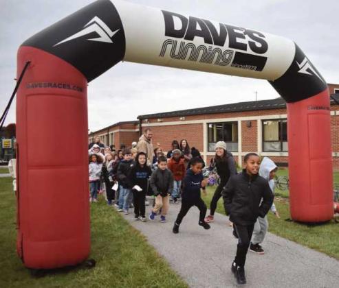Holloway second graders at the starting line of running the track.