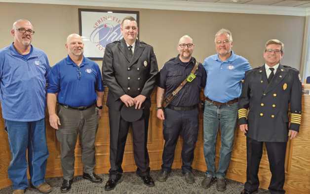 From left are Trustees Andy Glenn and Bob Bethel, Lieutenant Drew Pierson, firefighter/paramedic Logan Grow, Trustee Tom Anderson Jr. and Fire Chief Barry Cousino.