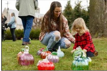 visitors of all ages marvel at handblown glass pumpkins created by TMA studio artists during the museum’s annual Glass Harvest, Sept. 27-28. The pumpkins are available for sale.