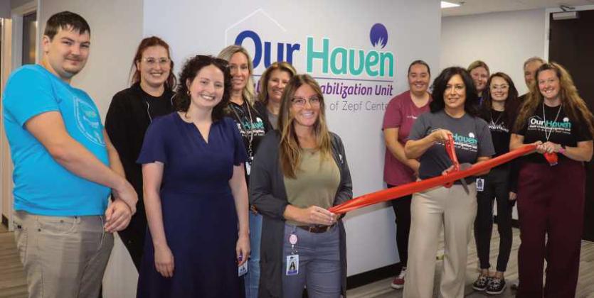 Crisis Team at ribbon cutting with Zepf Center CEO.