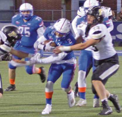 Runningback Taylen Miller finds an open hole in a tough Jacket defense.