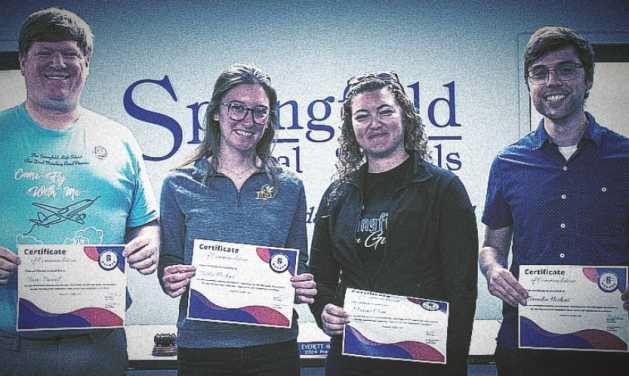 At the November 5 Springfield Local School District’s board of education meeting, Springfield High School band director and leadership team received commendations for their qualification and performance in the state marching band competition. Pictured are Travis Pennell, director; Trisha Hoskins, assistant director; Maxine Clum, color guard director, and Brandon Hoskins, percussion.