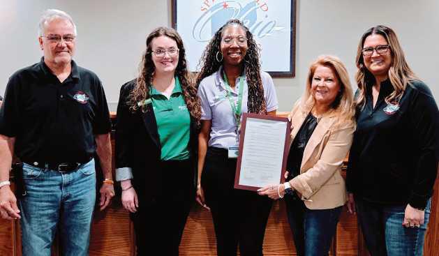 Springfield Township trustees honored adult Girl Scout leaders at their May 20 meeting. Pictured are Trustees Rachel Geiger and Tom Anderson Jr., with Girl Scouts Community Development Manager Lisa Caneles-Smith and members of her area leadership team.