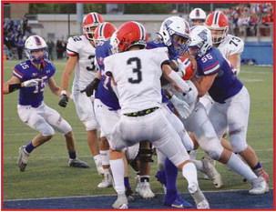 Runningback Eli Beal bulldozes his way into the endzone for Springfield’s only score on the evening.