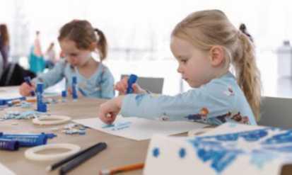 Young visitors create seasonal snowflake drawings during TMA’s 2024 Great Art Escape.