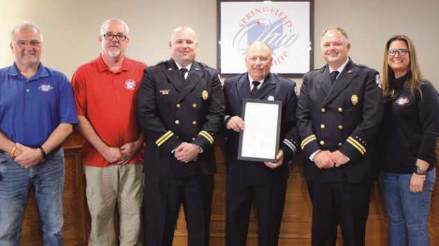 The trustees and fire department presented a proclamation to Alvin (Dutch) Neitzke, a 47year member of the department who is retiring on May 3. From left are trustees Tom Anderson Jr., Andy Glenn, acting assistant fire chief Andrew Sauder, Mr. Neitzke, acting fire chief Jonathon Ziehr and trustee Rachel Geiger.