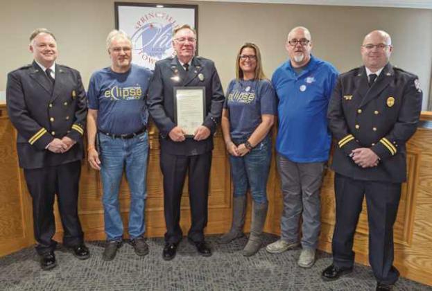 Recognizing firefighter/paramedic Ronald Bogedain third from left for his years of service, are Acting Fire Chief Jon Ziehr, trustees Tom Anderson Jr., Rachel Geiger and Andy Glenn, and Acting Assistant Chief Andrew Sauder.